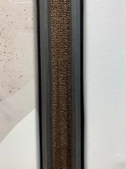 A close-up of the textured inner edge of our veneer floater frame, adding a subtle, sophisticated detail to the overall design.
