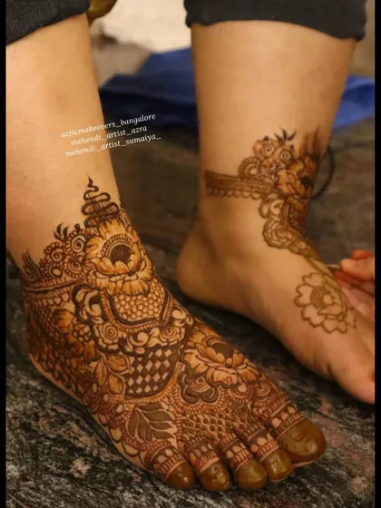 Another angle of the bridal foot mehendi, showing how the design wraps around the ankle.