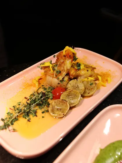 Grilled fish served with lemon and thyme. The simplicity of the ingredients is elevated by the precise cooking and elegant plating, showcasing our respect for fresh, high-quality produce.