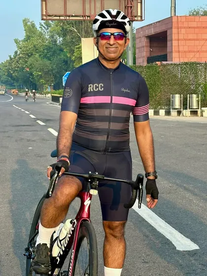 A portrait of the birthday boy on his bike, looking fit and happy.