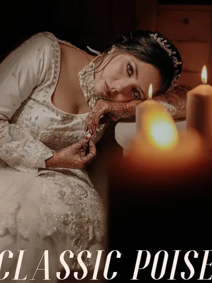 A portrait titled "Classic Poise," capturing the bride's elegant and contemplative mood by candlelight.