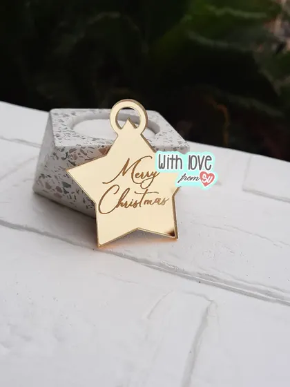 This star-shaped 'Merry Christmas' ornament in mirror gold is a simple yet elegant addition to any Christmas tree or gift hamper.