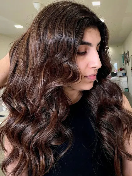 This exquisite Chocolate Brown color gives a touch of elegance and sophistication. The deep, velvety shade is styled in soft waves to show off its luscious, healthy shine.