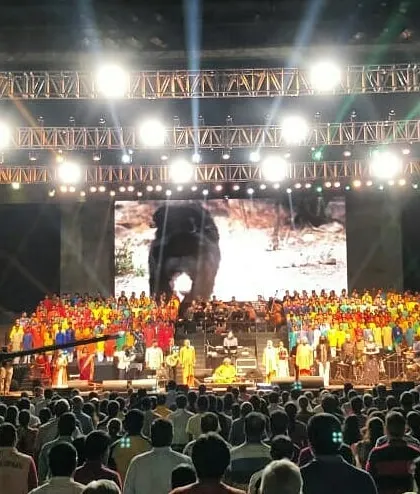 Performing on a grand stage for a massive audience during a concert with Ricky Kej. I am comfortable and experienced in delivering powerful performances for large-scale cultural and corporate events.