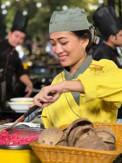 A smile of satisfaction from one of our talented chefs. Her joy in preparing colourful, fresh food for guests reflects our team's shared passion for creating delightful culinary experiences.