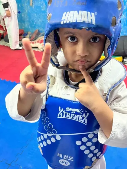 This little warrior is ready for action. We start them young, teaching them discipline and self-defence in a fun and safe environment.