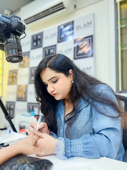 Dipika Parihar meticulously working on a nail design. This level of focus and precision is what we instill in all our students.