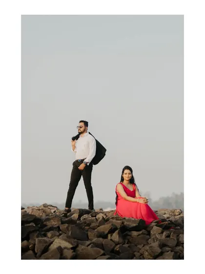 A stylish pose on the rocky shores. I guide couples into poses that feel both natural and cinematic.