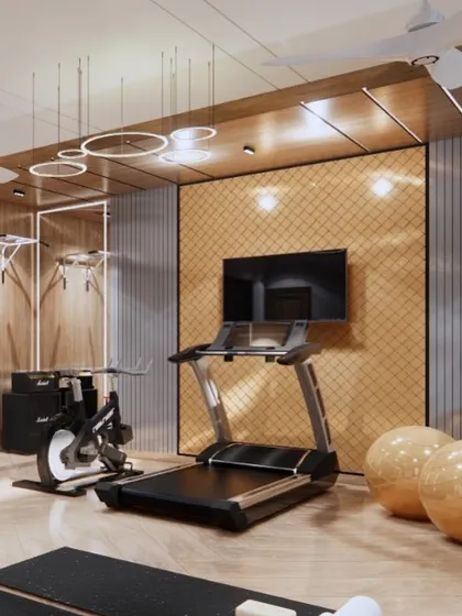A home gym designed for our Sigma 1 project, featuring a treadmill, stationary bike, and a dedicated area for strength training. The wood and mirror panels make the space feel larger and more dynamic.