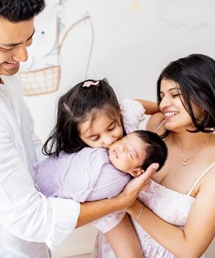 A beautiful family of four celebrating their newest member. I love capturing these moments against the backdrop of your baby's own nursery.