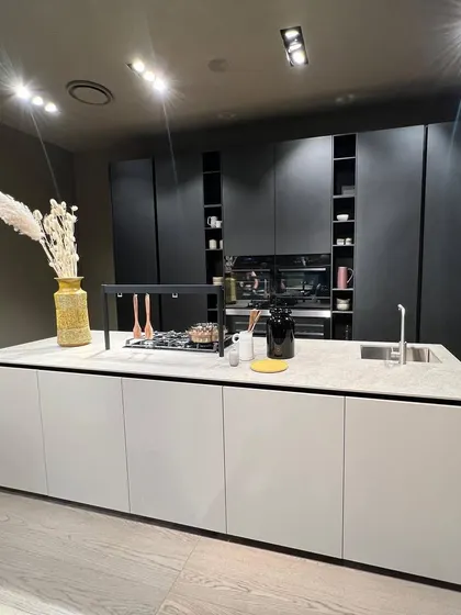 A minimalist kitchen island in black and white. The clean lines and simple color palette create a chic and classy look that is timeless.