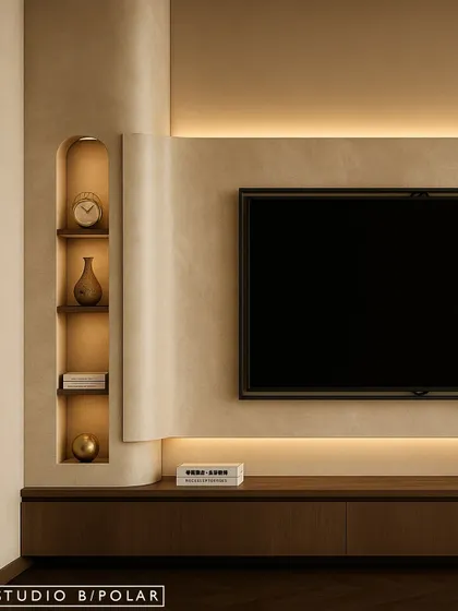 The TV wall is kept minimal and clean, with a floating console and recessed niches for display. Backlighting adds a soft, ambient glow, making the space feel cozy and inviting.