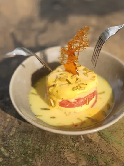 Two forks digging into our Watermelon Rasmalai. It's a dessert that's meant to be shared.