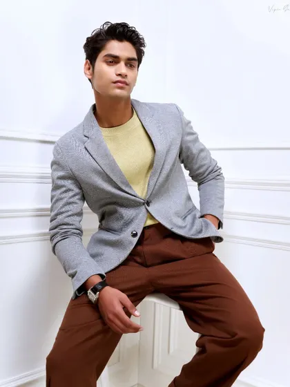 Another look from the same model portfolio shoot. The seated pose is more relaxed, showing a different, more contemplative side to the camera.