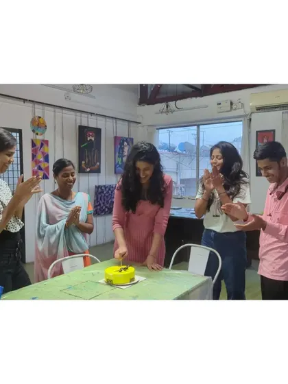 The joy of celebrating together in a creative space. These moments of connection are just as important as the art itself, especially during team-building workshops.
