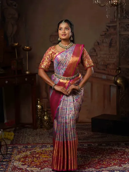 A full view of the finished look, showing how the "Fluffy Pleats" create a beautiful, structured fall for the saree.