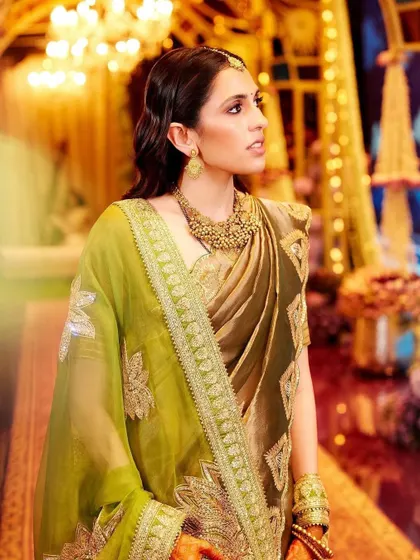 The golden hour glow on this Masaba saree is just perfect. The combination of the olive green and gold creates a regal and earthy vibe.