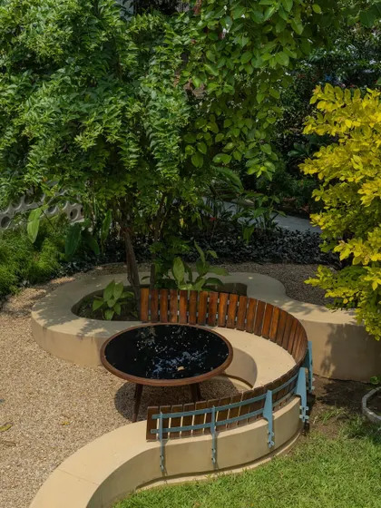 **Playfold, Ahmedabad:** This aerial shot shows how the curving bench wraps around an existing tree, integrating the design with the natural features of the site. The result is a space that feels both designed and organic.