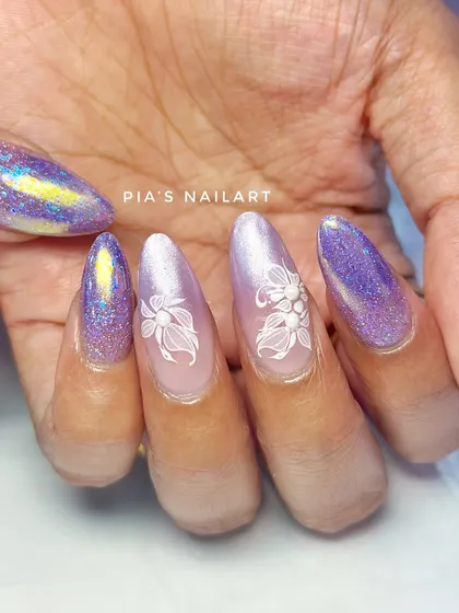 A beautiful combination of purple glitter, iridescent chrome, and delicate white floral art.