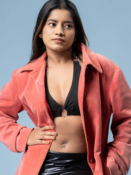 A close-up portrait from the same shoot, focusing on the model's confident expression.