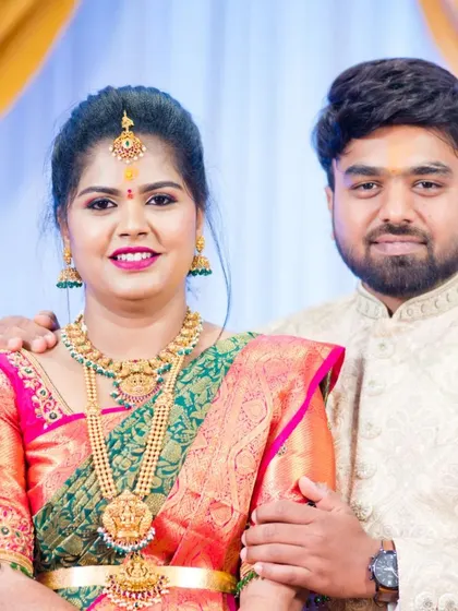 My client Ashwini and her partner at their engagement. I designed her blouse with peacock motifs on the sleeves to match her beautiful green and pink saree.