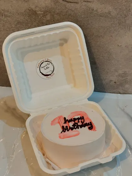 A simple and sweet "Happy Birthday" bento cake for a 12th birthday.