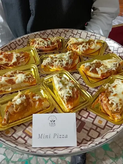 Our Mini Pizzas are always a hit, especially at kids' birthdays and casual get togethers. Topped with cheese and savory sauce, they are a simple and delicious party food solution.