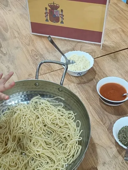 We even explored Spanish food, with children getting to mix their own pasta with tomato sauce.