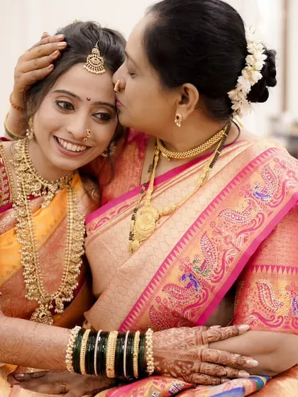 A mother's blessing. This touching photo shows the bride's beautiful makeup up close, looking soft and natural even in an emotional moment.