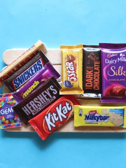 A beautiful flat lay of 10 different miniature chocolate bars from the online course.
