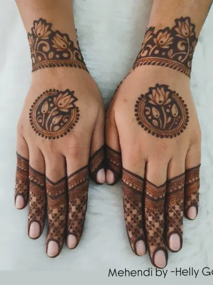 A beautiful back-hand design with a central lotus mandala. The fingers are intricately detailed, while the palm is left open.