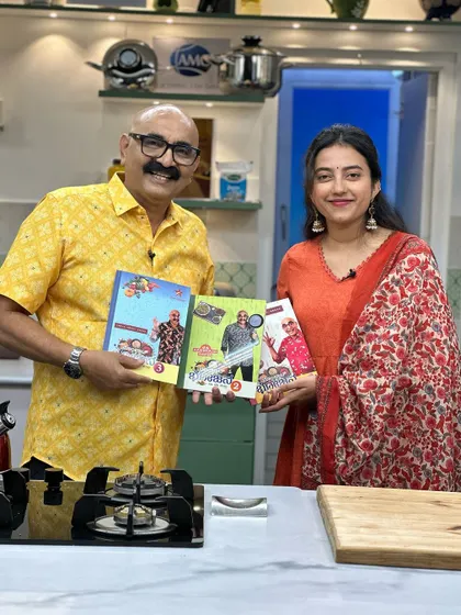 Holding up the 'Bombat Bhojana' cookbooks with Sihi Kahi Chandru sir. It was an honor to be on the show.