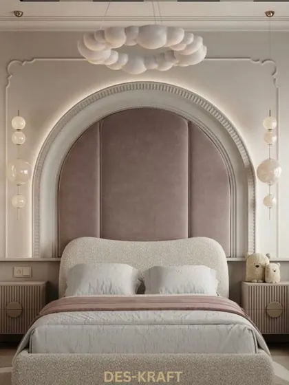 A frontal view of the bed, emphasizing the grand, upholstered arch and the whimsical cloud chandelier that make this room feel like a fairytale.