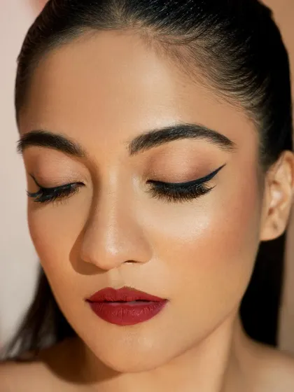 Another look at this perfectly executed classic liner with eyes closed. The line is smooth, and the wing is lifted perfectly for the eye shape.