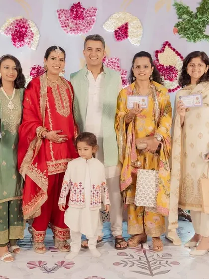 The winners of a game posing with the happy family.