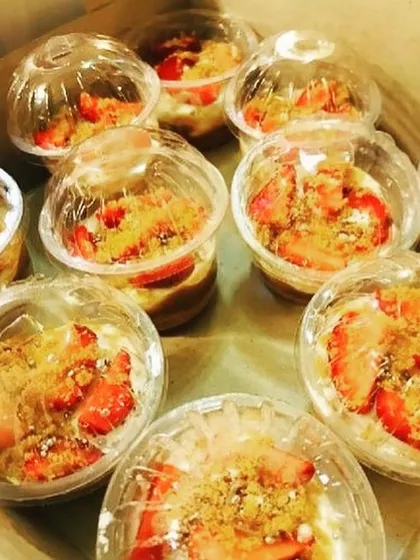 These are my Strawberry Banoffee Pie cups, ready to go. They have a buttery crust, a layer of toffee, bananas, cream, and fresh strawberries.