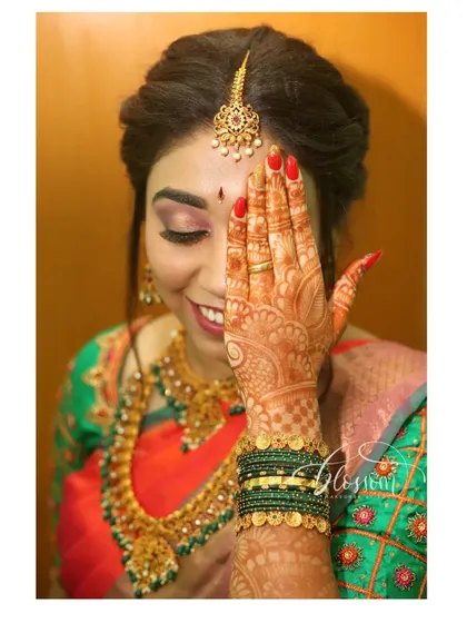 A playful shot showing off her beautiful henna and the soft, shimmery eye makeup for her engagement. It’s these little details that make the whole look come together.