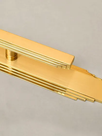 The Natali pull with its long backplate, demonstrating how the design can be extended to create a more dramatic and elongated statement on a tall door.