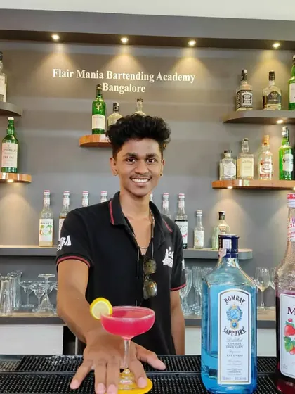 A student at our Bangalore academy with his perfectly crafted pink gin cocktail.