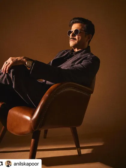 A seated portrait of Anil Kapoor, looking effortlessly cool.