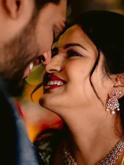 An intimate and romantic close-up of the couple. The bride's makeup looks flawless even from this angle.