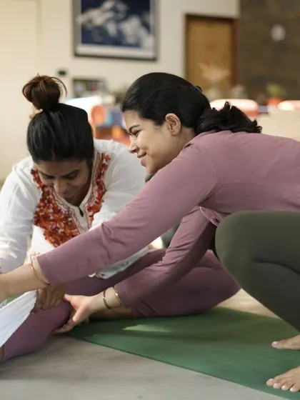 Working on a forward fold with a student. Using a strap can help maintain alignment and integrity in the pose, making it about the journey, not just the destination.
