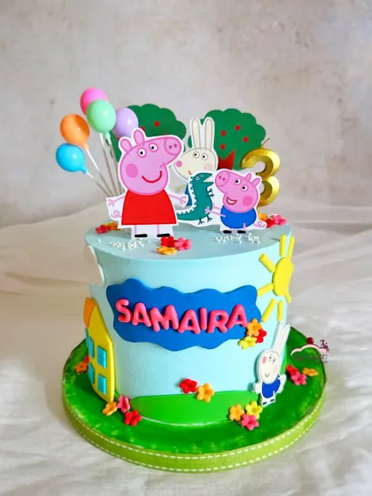 Peppa and her friends are ready to party! This cake features Peppa, George, and Rebecca Rabbit with colorful balloons and a bright sun.
