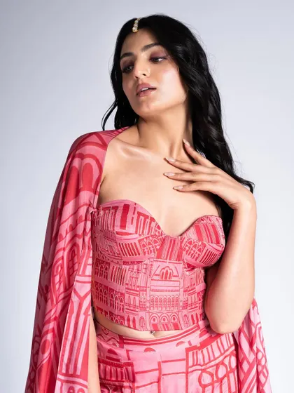 Another angle of the pink bustier top, showing the soft, romantic makeup with a subtle shimmer on the eyes and a simple maang tikka.