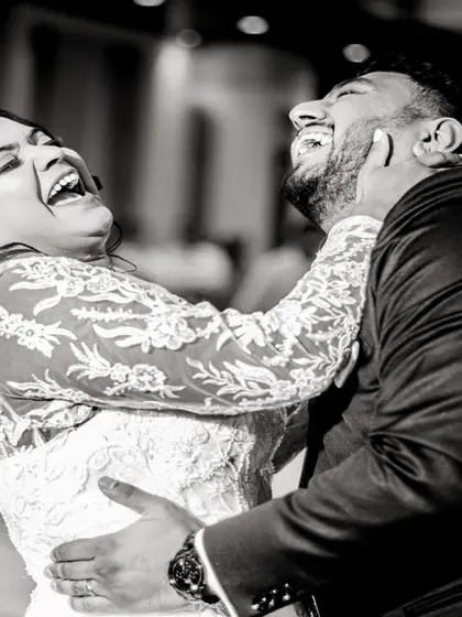 A moment of pure, uninhibited laughter during the first dance. These are the candid moments that truly tell the story of your day.