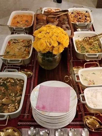 A vibrant and plentiful spread for a Lohri celebration. The menu features a mix of comforting main courses and a basket of assorted breads, perfect for a festive gathering.