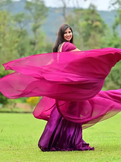 The magenta trail gown in motion. I love how the vibrant color and flowing fabric create such a dynamic and eye-catching image.