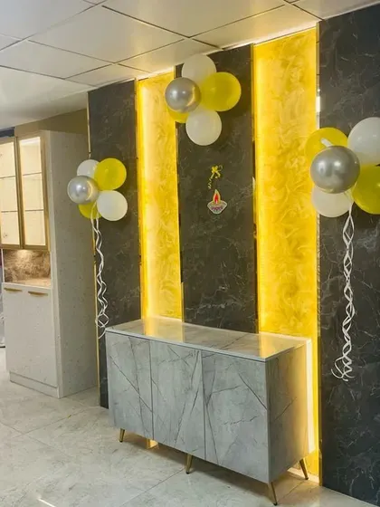 A stylish console table against a backlit wall panel, part of the festive opening display at my Indiranagar Experience Center.