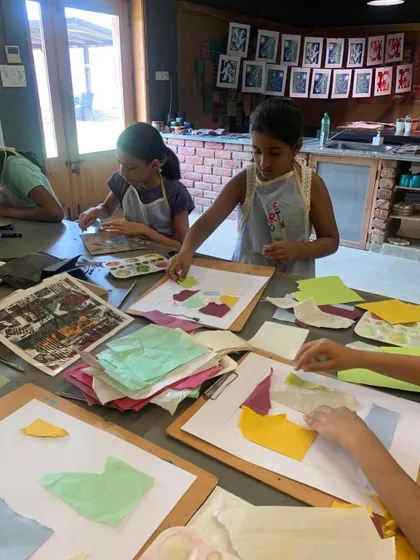 Students in a collagraphy module work on their plates, using collage techniques with different papers and textures. This preparation stage is where the foundation for the final print's unique look is built.