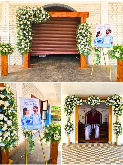 The entrance decor for Rijo and Gigi's church wedding. A rustic wooden arch was adorned with white and blue florals, and a personalized welcome sign greeted guests as they arrived.